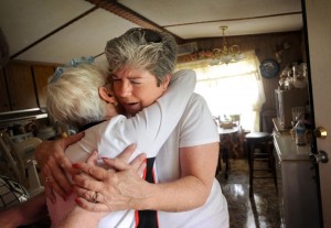 Cheryl Randall of Candlelight Outreach Ministries hugs Beulah Abbott